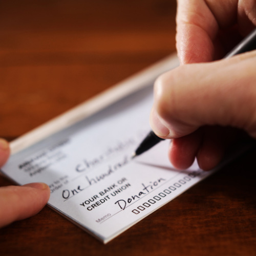 A donation check being written